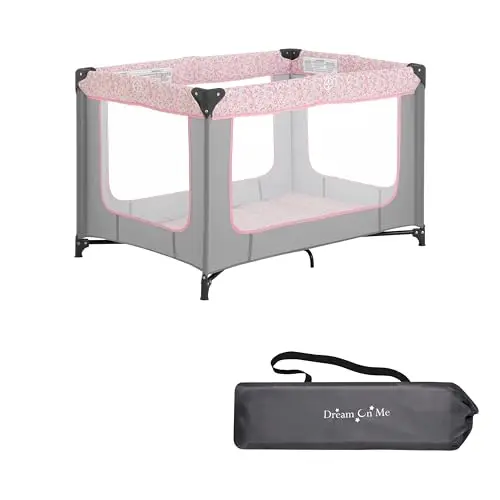 Dream On Me Zodiak lightweight portable playard folded with carry strap