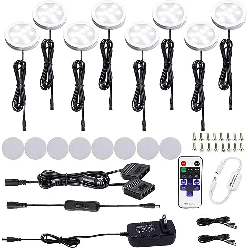 AIBOO 8-pack of small round LED puck lights installed under a cabinet.