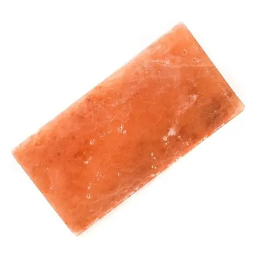 Pink Himalayan rock salt block for deer and livestock on the ground