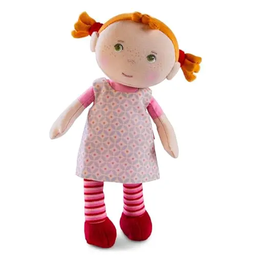 HABA Snug-up Roya soft plush baby doll with red yarn pigtails and a removable dress