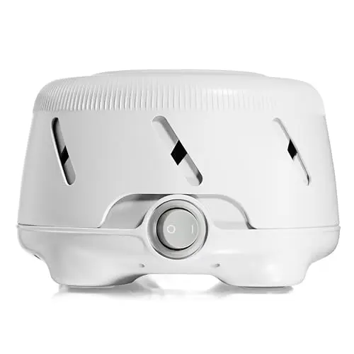 Yogasleep Dohm UNO white noise sound machine on a bedside table