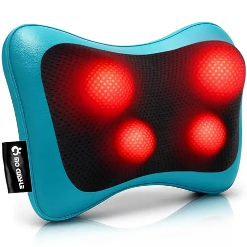 Black shiatsu back massager pillow with straps on a living room chair