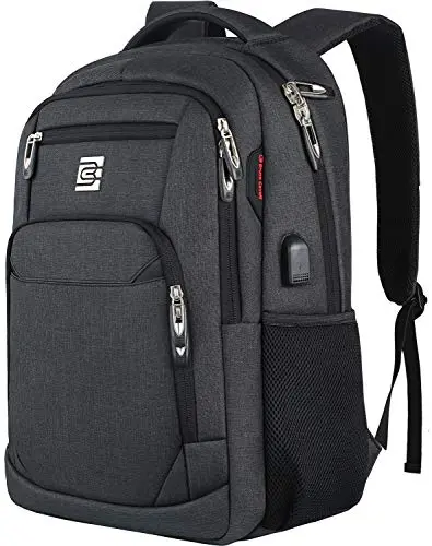 Slim black Volher laptop backpack with USB charging port sitting on a luggage suitcase