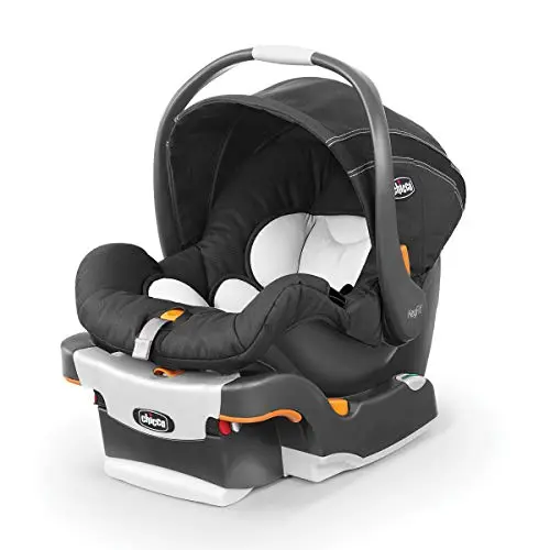 Chicco KeyFit infant car seat installed in the back of a small car