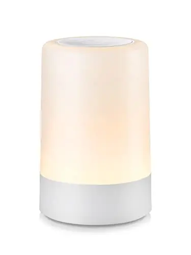 G Keni white portable touch night light on a bedside table