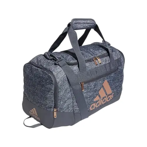 adidas Defender 4.0 Duffel Bag in grey and rose gold, showing side pockets and water-resistant base.