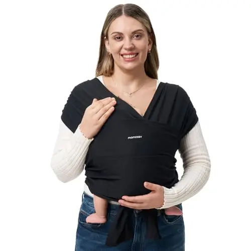 Momcozy black stretchy baby wrap carrier, showing how it crosses over the wearer's back.