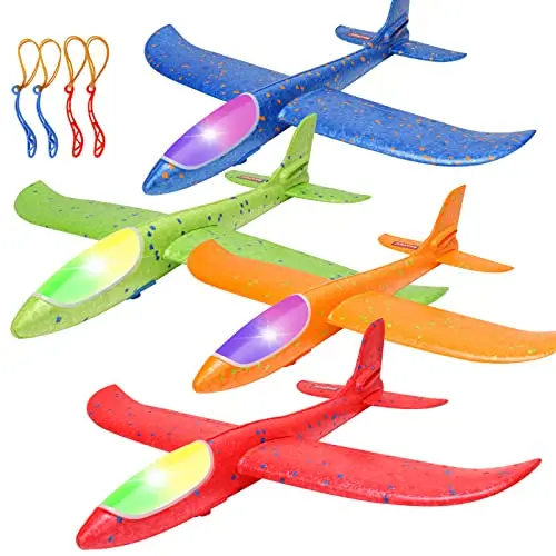 Four large foam glider airplanes in different colors, with detachable wings