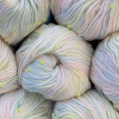 Tweed Twinkles Soft Baby Yarn 8-pack, showing multiple creamy white skeins with colorful flecks.
