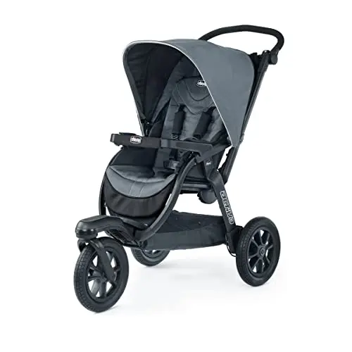 Chicco Activ3 jogging stroller in Eclipse/Grey color navigating a rocky path