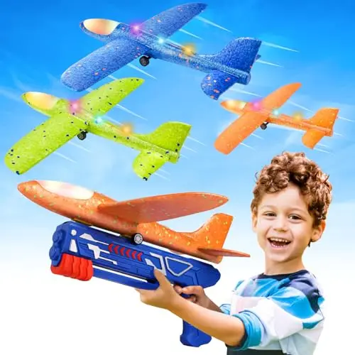 Set of three colorful LED foam glider airplanes with launcher