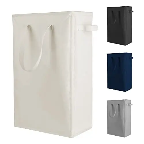 Odonata beige collapsible laundry hamper standing in a narrow space.