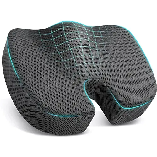 TushGuard grey U-shaped memory foam seat cushion with a carrying handle, shown on a car seat.