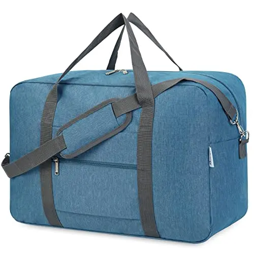 Navy Blue Packable Duffel Bag folded next to a suitcase for size comparison
