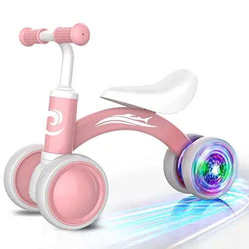 Pink toddler balance bike with colorful light-up wheels