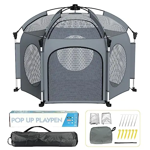 PRObebi grey pop-up playpen with three attached sun shades at the beach