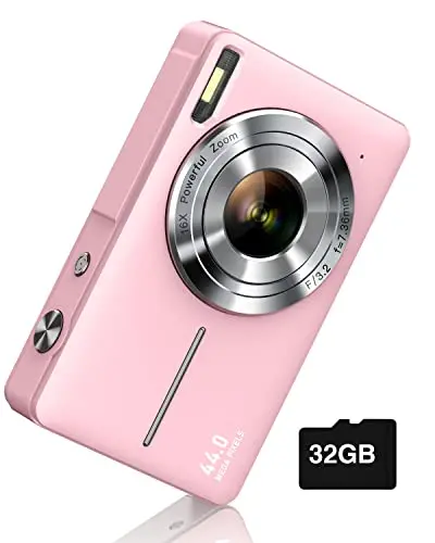 CAMKORY pink compact digital camera being used by traveler outdoors