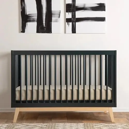 Dadada Soho crib in black and natural finish, showcasing modern spindle design