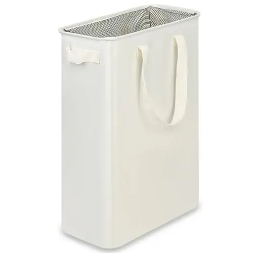 efluky beige skinny laundry basket with a mesh top in a bedroom.