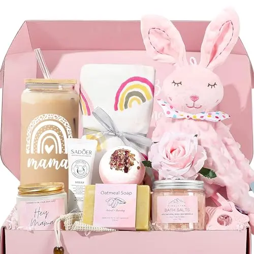 Pink-themed new mom gift basket with glass cup, bunny lovey, blanket, and bath products