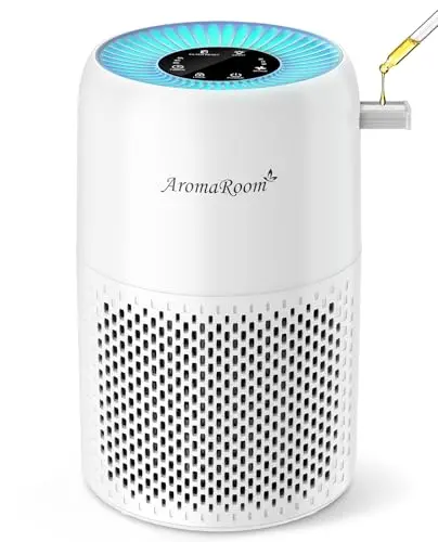 AromaRoom small white cylindrical air purifier with a top light ring on a nightstand
