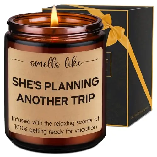 LEADO brown glass candle with 'Smells like she's planning another trip' label