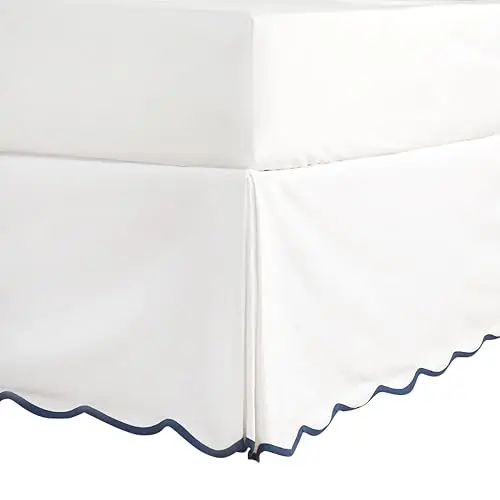 HIG Chic Queen Bed Skirt in off-white with scalloped edges draped neatly over a bed frame