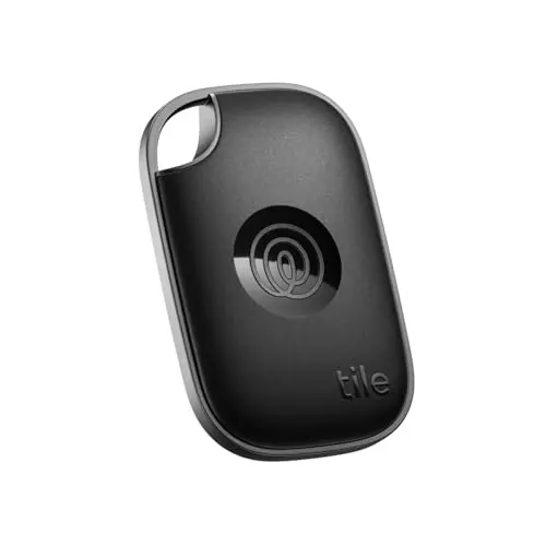 Tile Pro tracker attached to a set of car keys and a luggage tag.