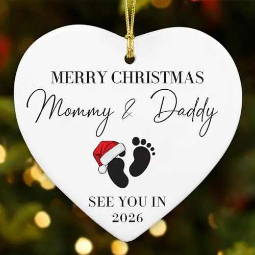 White ceramic Christmas ornament with pregnancy announcement design