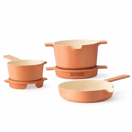 Alva Neat 5-piece nonstick cookware set in peach color, showing nesting pots and pans