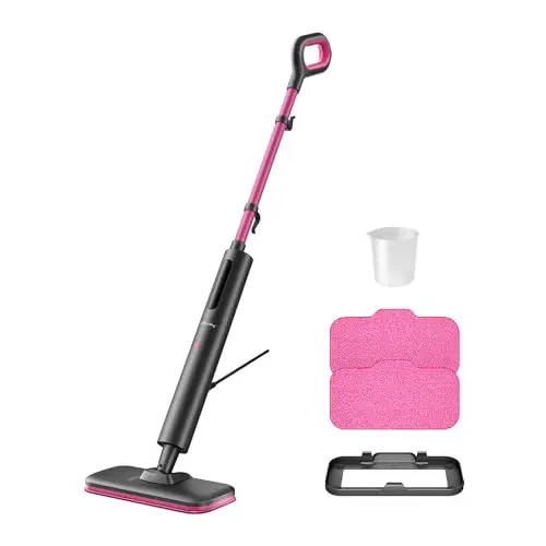 Schenley pink and gray self-standing steam mop leaning against a wall
