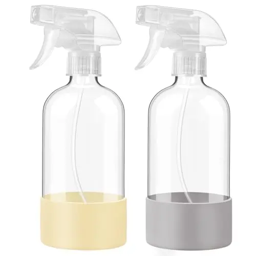 Glass spray bottles with removable silicone sleeves in pale yellow and grey