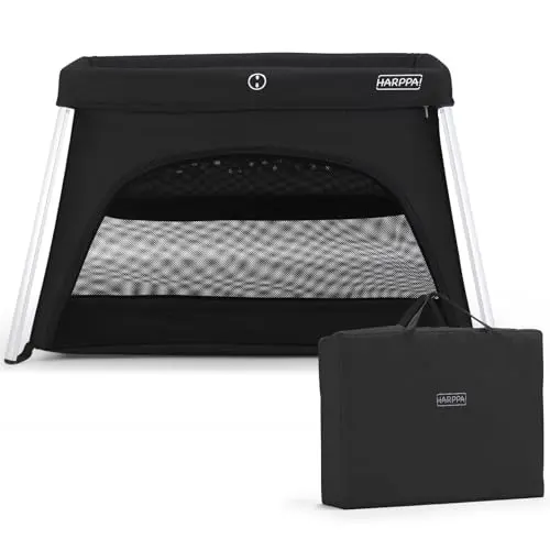 HARPPA Travel Crib in black, set up with side mesh and folded compactly