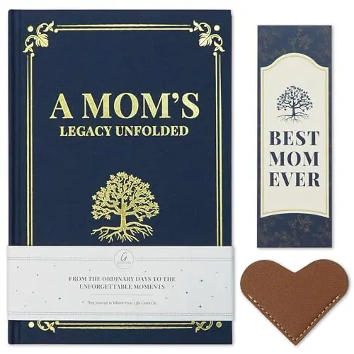 Blue hardcover journal with 'Mom's Legacy' gold foil text on a wooden desk