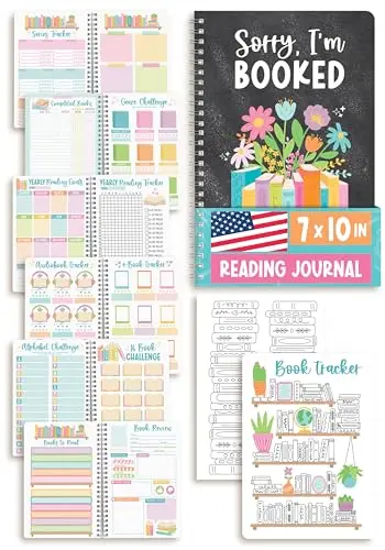 Hadley Designs Reading Journal open on a table with a pen, showing tracking pages