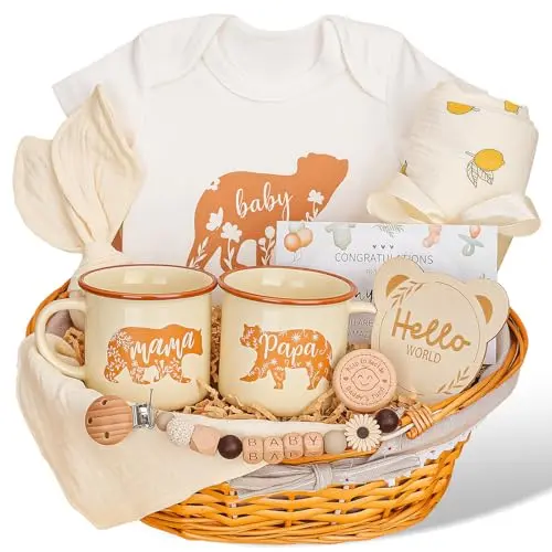 Elysirise New Parents Gift Set arranged in a handwoven wicker basket, featuring ceramic Mama and Papa mugs, a onesie, swaddle, bib, pacifier clip, teether, birth plaque, and decision coin.