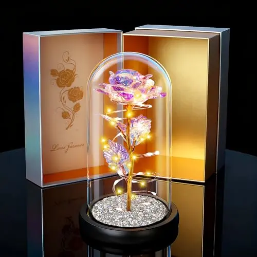 Childom colorful crystal rose in a glass dome with LED lights glowing on a sparkling base