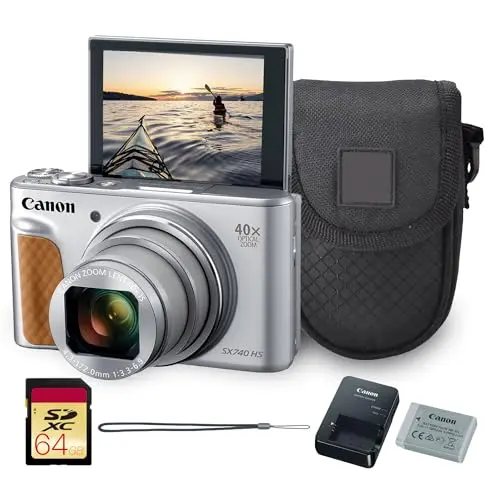 Silver Canon PowerShot SX740 HS camera with its lens extended, showing its long zoom range
