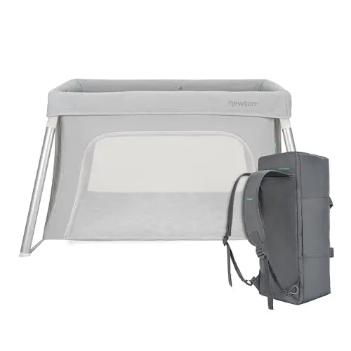 Newton Baby Compact Travel Crib folded into a compact carry-on with backpack straps