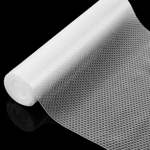 IUI Shelf Liner roll with clear dot pattern on a kitchen shelf