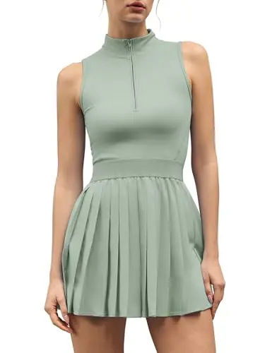 QINSEN Two Piece Active Dress in smoke green showing high neck, front zipper, and pleated skirt with separate shorts